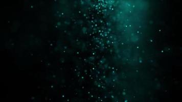 Abstract blurred festive green blue particles bokeh flow down video