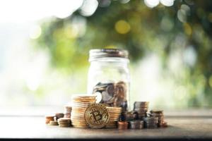 Money coin,save money,natural background on wooden table photo