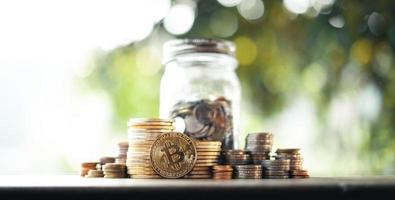 Money coin,save money,natural background on wooden table photo