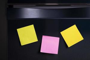 Empty note paper sheet on refrigerator door. Text memory story of life in note paper photo