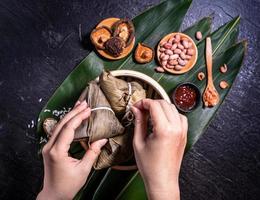 Zongzi, delicious fresh hot steamed rice dumplings in steamer. Close up, copy space, famous asian tasty food in dragon boat duanwu festival photo