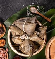 Zongzi, delicious fresh hot steamed rice dumplings in steamer. Close up, copy space, famous asian tasty food in dragon boat duanwu festival photo