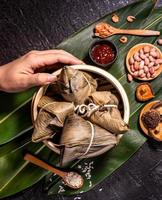 Zongzi, delicious fresh hot steamed rice dumplings in steamer. Close up, copy space, famous asian tasty food in dragon boat duanwu festival photo