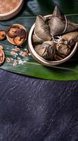 Zongzi, delicious fresh hot steamed rice dumplings in steamer. Close up, copy space, famous asian tasty food in dragon boat duanwu festival photo