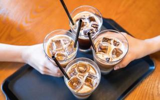 Party concept, girl with friends hold coffee cups and say cheers happy hangout together in cafe, lifestyle, copy space, top view, close up photo