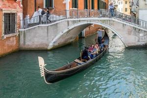 Venice, Veneto, Italy, 2014. Gondolier plying his trade photo