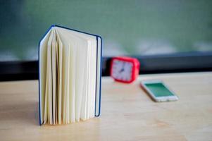 Hands and books that are laid bare with space In the morning room Book reading concept photo