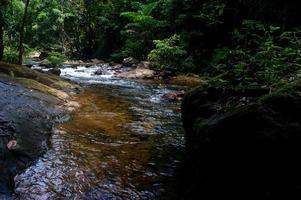 Natural waterfall, shoulder river, through the top of the mountain photo