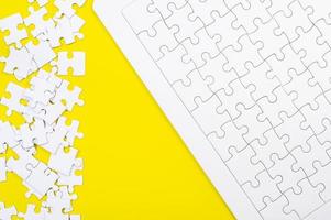 A jigsaw puzzle on a yellow background Business idea photo