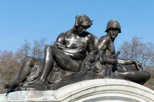 London, UK, 2015. Statue on the Queen Victoria Memorial outside Buckingham Palace in London photo