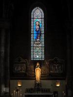 Bordeaux, France, 2016. Stained Glass Window in the Church of St Martial in Bordeaux photo