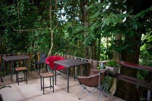 Table, chair, recreation area in the forest photo