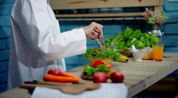Chef's hand, cooking vegetable salad, healthy food Cooking concept