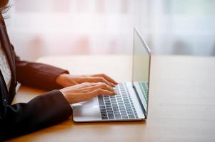 Computer hands of businessmen are working. In the business concept photo