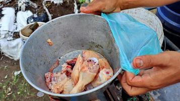 Street chicken vendor selling in the village photo