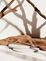 3d minimal white concrete display podiums with brown fabric and tree branches against white background. 3d rendering of realistic presentation for product advertising. 3d minimal illustration. photo