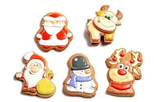 Set of christmas multicolored gingerbread cookies with icing on white
