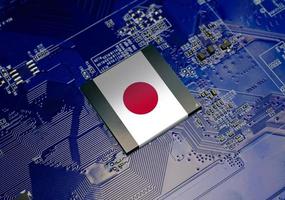 Japanese flag on CPU operating chipset computer electronic circuit board, Republic of japan technology or hardware development related conceptual photo