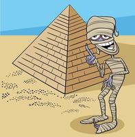 personaje de momia de dibujos animados y pirámide en el desierto vector