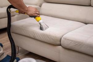 Cleaning a dirty sofa with a sofa washer photo