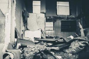 Houses and fields in ruins, demolished, abandoned and junkyard photo