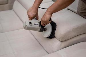 Cleaning a dirty sofa with a sofa washer