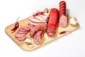 Set smoked salami and sausage on a wooden kitchen Board