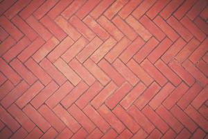 Top view of the old brown bricks floor background in zigzag pattern with vintage tone style photo