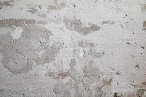 Cracked and abstract grunge texture. Aged material surface backdrop. Weathered effect pattern. Old and dirty background. photo