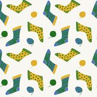 Seamless pattern of cozy knitted socks vector