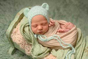 Closeup portrait of newborn baby with smile on face. Healthy and medical concept. photo