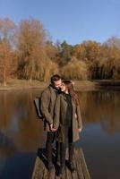 Lovely couple spending autumn day outdoors photo