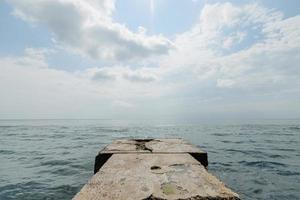 Beautiful pier on the background of the sea photo