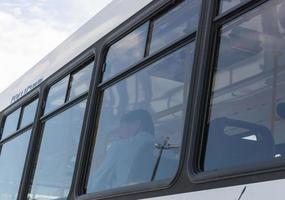 Buenos Aires, Argentina, 2019. Lonely man inside bus photo