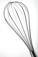 Stainless steel Egg Whisk or Egg Beater on white photo