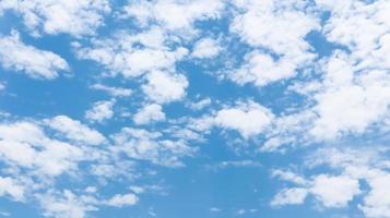 Blue sky background with white tiny clouds. photo