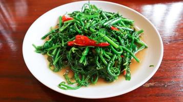 Stir fried paco fern salad with oyster sauce. photo