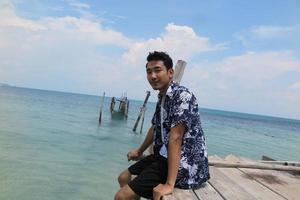 man on wooden bridge photo