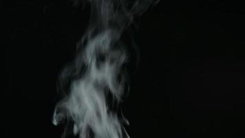 White smoke, fog, mist, vapor on a black background. 4K footage. video