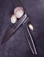 garlic bulbs and knife photo