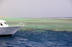 white boat on reef photo