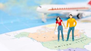Miniature people, Couple standing on map American