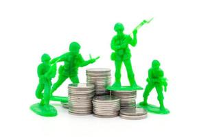 Toy Soldier on coin stacks a white background photo