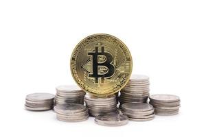 Bitcoin and coins on white background photo