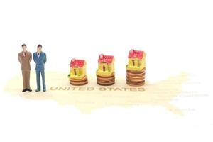 Businessman and house on map American. Miniature people photo