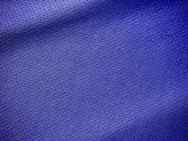 textura de jersey de tela de ropa deportiva azul foto