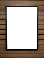 blank white picture frame on wood background photo