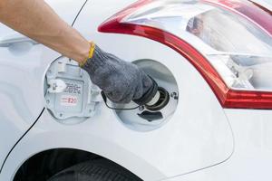 Hand opening the oil filler cap photo