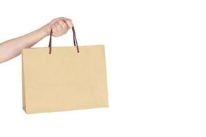 Female hand holding shopping bag photo