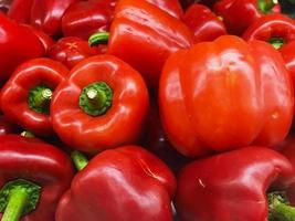 Fresh red sweet bell peppers photo
